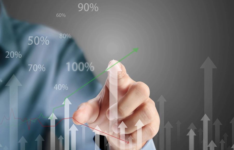 Hand pointing at a rising growth chart
