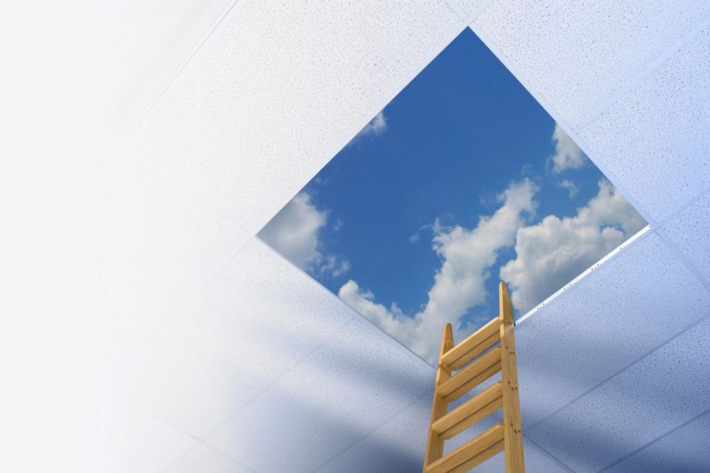 Ladder reaching up to a blue sky